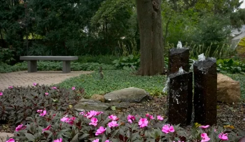 stone column fountains with flowers