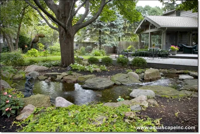 Lots of shade and the cool waters of a water feature provide sweet relief from summer's heat.