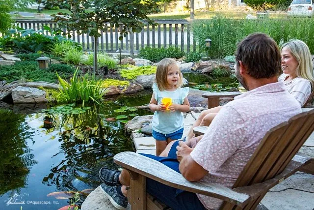 Family by backyard pond