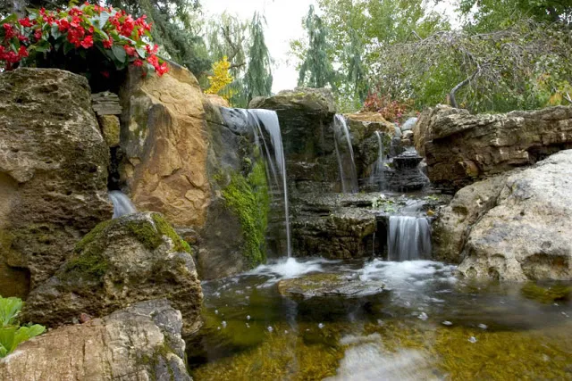 Rocks with moss already intact were specifically chosen to lend an aged appearance to this relatively new water feature.