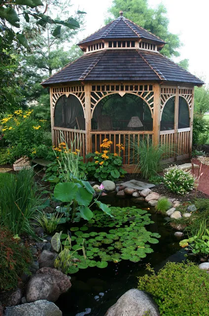 Beautiful landscaping of waterlilies, lotus, and terrestial plants create the perfect garden scene for both relaxing and entertaining in the gazebo.