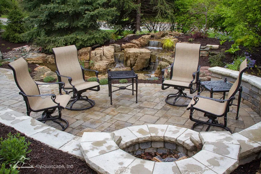 Not only can these homeowners enjoy a fire but can also listen to the sounds of the waterfalls in the background as they relax on their patio.