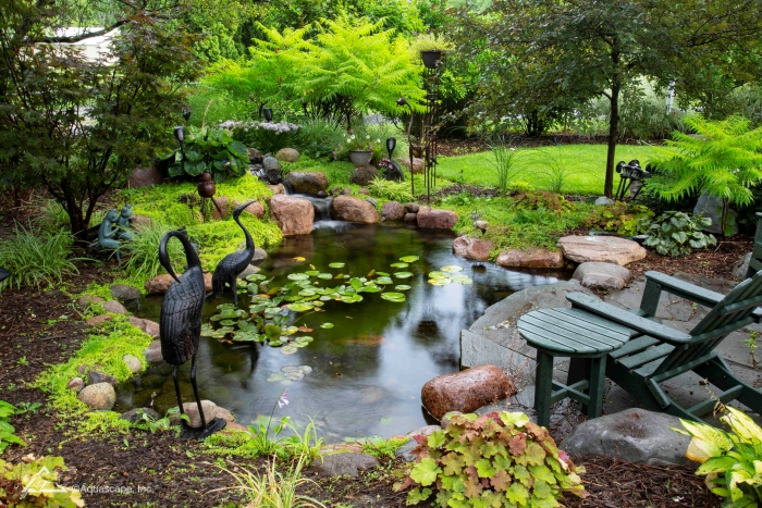 Healing Pond in Backyard with Patio and Adirondack Chair