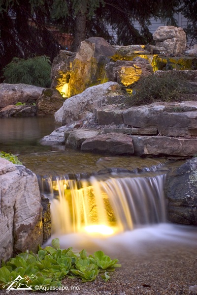 Backyard Waterfall with Lighting at Night