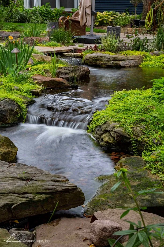 Manmade waterfall in residential backyard