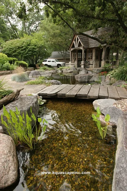 A rustic footbridge provides access from the lower patio over a stream.Here you can dangle your feet and cool your tootsies.