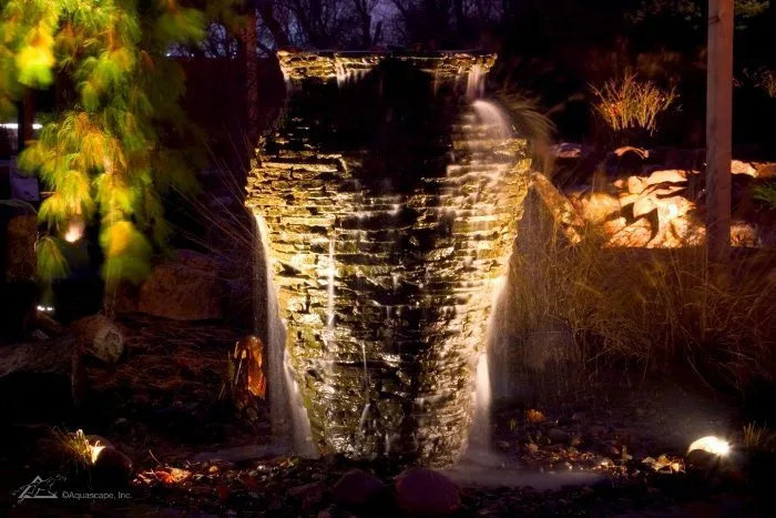 Outdoor Fountain at Night with landscape Lights