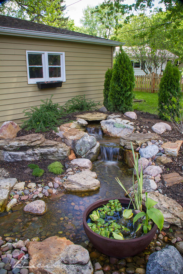 How a Pondless Waterfall Created an Outdoor Retreat ...