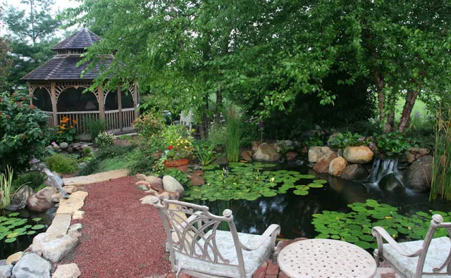 Enjoy sitting in the lovely patio chairs to view the waterfall, fish, and butterflies