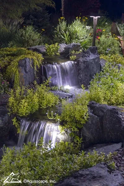 Backyard Waterfall with Lighting at Night