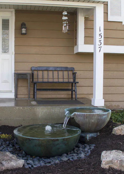Spillway bowls at front entrance of home