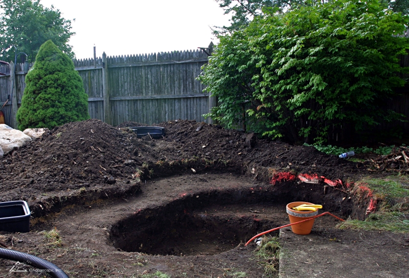 Excavating Plant Shelves in a Backyard Pond