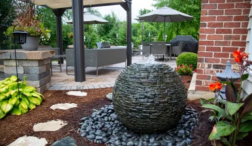 sphere fountain near patio